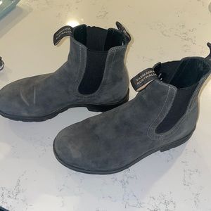 Gray woman’s Blundstone boots.